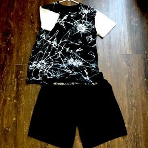 Black and white top with solid black shorts for boys.